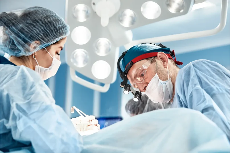 concentrated-surgical-team-operating-a-patient-in-physiozen